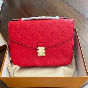 monogramed red leather louis vuitton side bag